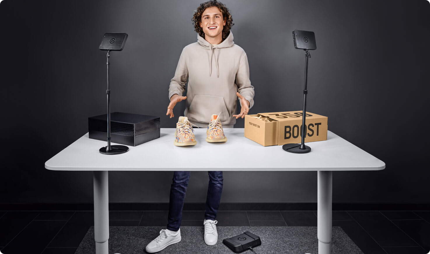 content creator unboxing a product with two Key Light Mini as lightings in the setup