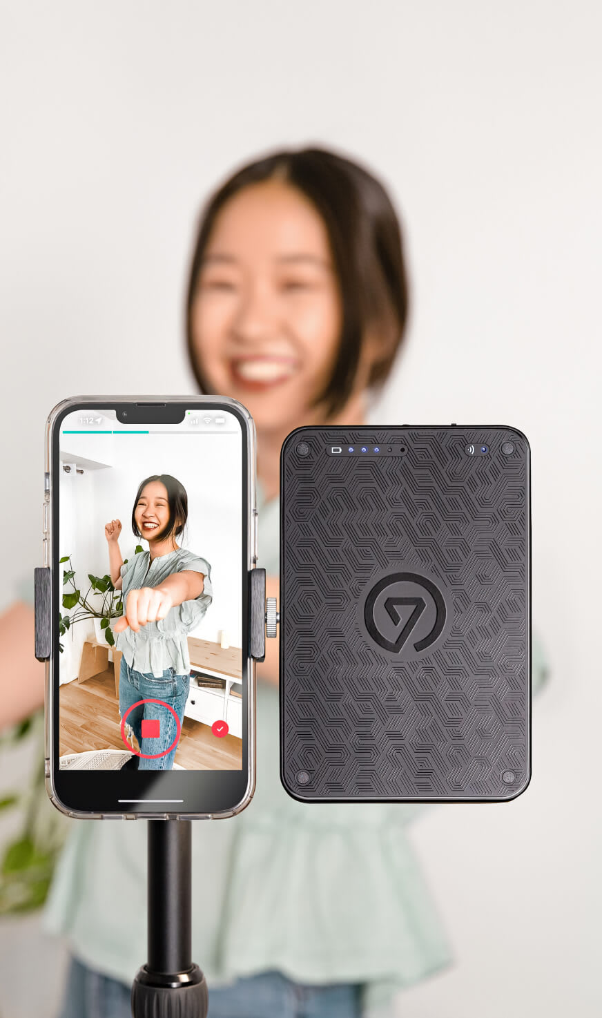 Content creator using key light mini attached to a smartphone holder